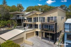  2/21 A Dress Circle Drive Lennox Head NSW 2478 Located in the golden triangle of Dress Circle Drive with breathtaking ocean views, this perfectly positioned and light filled 3 bedroom townhouse offers seaside living with the convenience of a short stroll to the vibrant village centre with its eclectic mix of retail shops, cafes and restaurants and also Seven Mile beach - one of the finest beaches on the east coast of Australia and home to the world-famous Lennox Head Point surf break. The open plan living and dining areas open onto a 6 x 6 metre tiled deck, perfect for entertaining from sunrise to sunset whilst taking advantage of the glorious sea breezes. Also on this level is the designer kitchen equipped with a 5 burner gas stove, European appliances and adjoining scullery truly a chefs delight. On the third level, the east facing panoramic view from the master and second bedrooms can never be built out. Relish the prospect of watching the whales and dolphins frolicking from the balcony whilst sipping on your morning coffee. More than just a house, this property offers you a lifestyle that can be cherished for generations to come. Many Extra Features Include: * Superb ocean views from both living and bedroom levels * 3 bedrooms, master with ensuite and double vanity * Modern kitchen equipped with European appliances and adjoining pantry and scullery * Oversized double garage with internal access * Powered workshop * 6x6 meter tiled deck with marine-grade 316 stainless steel balustrade for increased corrosion resistance * Bedroom level balcony access from master and second bedroom * Large attic space with retractable ladder for extra storage * Boardwalk staircase allowing side access to deck * Outdoor hot shower.. 