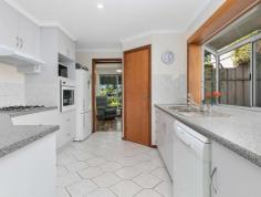  6 Raleigh Lane Seaford Rise SA 5169 $459,000-$469,000 Immaculately presented to perfection, with gorgeous gardens manicured to the petal, this fabulous four/five bedroom home, features two bathrooms and an abundance of wonderful quality living space, totalling a whopping 169sqm of heaven amongst the bloom. With an enormous outdoor entertaining vaulted pergola that will take your breath away, the home is blessed with a warm and cherished ambience and is positioned for convenience, handy to major shopping, schooling, public transport, including the Seaford Train Terminal, and of course, all the fun of the beach just a few blocks away! A low care, yet lusciously evergreen front garden, delivers just a hint of the delight to come, whilst a double driveway provides extra off street parking and leads to the under the main roof secure garage parking, with auto roller door and easy, drive through access to the beautiful paradise that is, the rear of the property. Stepping in to the front foyer and the character and class of the home is immediately on show, whilst the open plan layout, accentuates the feeling of spaciousness on offer. To the left of entry, the front formal lounge is graced with the elegance of polished pine flooring, blended beautifully with the modern tones and dcor of today. The master bedroom to your right of entry, is spacious indeed, in keeping with the bigger is better theme of the home and accentuated by the functionality of the bay window. Kept in comfort by the services of a reverse cycle split system air conditioner, the masters quarters enjoys the services of a walk in robe and a sizable ensuite for convenience. Further down the passage, the home blossoms into open plan living at its finest, with the open plan front lounge, leading to the generous expanse of the very large, light, bright and homely, informal family living room, adjoining the family dining area and the central feature kitchen. Boasting a handy breakfast bench, an electric oven and four burner gas cook top, a dish washer and endless cupboard space, complimented by the walk in pantry, the kitchen is kept in natural light by the box window over the sink. A pleasing feature, the window captures the calm of the gardens beyond, allowing the chef of the day, to drift serenely between recipes, whilst all the while, remaining a part of the conversation. The adjoining study is the ideal student retreat or games room and could very easily be converted to a fifth bedroom/nursery. It just depends on your needs. A passage off the family room, leads to bedrooms two, three and four, which again, are very spacious with all featuring built in robes, but it is bedrooms two and three, that will grab immediate attention, with both bedrooms featuring sliding door, independent access, to the outdoor entertaining pergola and beyond to the tranquillity and soothing aspect of the gardens, right from your bedroom pillow. However, one suspects, that the older teenager, may have a greater interest, in the ability to sneak in at 2am, beyond curfew and undetected. All are serviced by the homes main bathroom which, is quite simply.enormous. Featuring both shower and bath and a second toilet for family convenience, one could easily host a pyjama party in the bathroom and still have room to shower the night away. Opposite is the laundry, with easy independent access to the rear clothesline and a very handy work bench whilst sliding doors off the family room, deliver access to the stunning, outdoor, vaulted entertaining pergola, a jaw dropping, breath taking, feature in itself. A decently proportioned garden shed , ensures that hubbies, concreted and powered workshop, with sea views, remains free of garden equipment that might silently suggest.work, but it is without doubt, the captivatingly, enchanting gardens that will capture the heart of the green thumb and steal the show for all who visit. Gorgeously private, fully fenced and secure and boasting sea glimpses in the distance, the peacefully serene, picturesque garden setting, is the perfect way to forget your daily grind. A wonderful way to unwind. With an endless list of added features such as the gas heating throughout, or the modern ceiling fans in every bedroom, or the fibre to the premise NBN connected, or the solar power system, or the brand new character floating floors, along with much, much more, this fabulous home is ideal for first or second home owners or those with larger families and the perfect opportunity to consolidate an extended family. And it's all, so close to the beach, in a wonderfully peaceful neighbourhood! FEATURES: • 	 Air Conditioning • 	 Built-In Wardrobes • 	 Close To Schools • 	 Close To Shops • 	 Close To Transport • 	 Garden • 	 Sea Glimpses.. 
