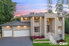  1 Glenshee Pl Glenhaven NSW 2156 $2,000,000 Proudly sitting on a leafy elevated 861m2 landscaped block is this architecturally designed tri level residence exudes luxury and class throughout. This extravagant home offers an extensive floorplan showcasing a contemporary style with grand proportions including a formal living, a multitude of expansive modern casual living and dining zones extending through to a tranquil entertainer's haven. The stunning home is set in an exclusive pocket of Glenhaven amongst other prestigious homes whilst you are only moments away from desirable amenities including to schools, shops and transport facilities. Property Features: • Grand entrance foyer welcomes you upon entry • Sun drenched formal living with floor to ceiling windows to enhance the natural light • Gourmet kitchen features gas cooktop, quality stainless steel appliances, Caesarstone bench tops, large island breakfast bench plus butlers pantry • Expansive open plan casual living and dining extends to the outdoors via large sliding doors • Spacious study / home office is ideally located of the entry foyer • Generous master suite enjoys tree top views plus huge walk in robe and lavishly appointed ensuite with free standing bathtub • Additional three double sized bedrooms, two with walk in robes and built in robes to the 2nd bedroom • Modern sleek family bathroom with free standing bathtub, floor to ceiling tiles and separate toilet • Third bathroom conveniently located at the entry level • Huge upstairs family room / teenager retreat • Vast rumpus / billiards room privately located on the ground floor and flows to the outdoors • Covered alfresco entertaining area with an additional outdoor entertaining area creating a tranquil haven to relax • Sparkling inground mineral pool with travertine tiles set amongst a private tropical setting • Pristine landscaped lawn and gardens surround the home • Automatic triple car garage with internal access • Large wine cellar with tasting nook / wet bar • Additional noteworthy features include porcelain tiles, ducted zoned air conditioning, outdoor fan, alarm system and much more Location Benefits: • Comfortable 1.6km walk to Samuel Gilbert Public School and zoned for Castle Hill High School • 1.5km walk to refurbished Knightsbridge Shopping centre with Woolworths Metro • Castle Towers shopping, dining, entertainment and transport precinct a short 3.5kms drive away • Metro train stations located at Hills Showground with parking facilities (3.8kms) and Castle Hill station (3.7kms) • A short 110m stroll to local bus services on Gilbert Road 