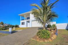  29 Sea Esplanade, Elliott Heads QLD 4670 $749,000 This perfectly built executive “award winning” home is absolutely stunning and deserves your viewing to really appreciate all it offers. For all enquiries and private inspections contact Michael Nash directly. Features include: – Award winning Norm Wales Constructions Home, received recognition as a Class winner in the 2018 Queensland Master Builders Awards – Well elevated to capture the sea breezes and the superb view, you will be immediately drawn into the welcoming family feel as you enter the wide quality crafted timber front door – The kitchen is just stunning and features stone bench tops, soft close drawers and quality SMEG gas cooktop, oven and dishwasher. The large fridge space is plumbed for an ice making fridge. There is a large walk-in pantry with frosted glass door and internal power points – Open plan lounge and dining area offer spectacular views up and down the coast and opens onto the large front balcony with a feature glass powder coated balustrade which will provide many hours of relaxation and outdoor living – Three good size bedrooms are positioned downstairs and all offer ceiling fans and are bright and airy – Large downstairs living area that overlooks the rear covered verandah which provides another option for the family to enjoy – The main bedroom upstairs is large in size and includes a walk through wardrobe and en-suite which includes dual vanities and large shower space – The 866m2 yard is fully fenced and provides side access for boats and or caravans. There is also a 46504650 shed for storage – Keep your power bills to a minimum with the 5KW Solar system with “catch power attached’ – There are many additional features in the high quality build that you just need to see for yourself so be sure to contact Michael today as inspections are available immediately AT A GLANCE: – Built 13 October 2017 – Security Screens throughout – Built to Category 3 cyclone rating – 2550mm ceilings throughout INSIDE – 4 Bedrooms, main with walk through robe and en-suite – Ceiling fans to every room – Smoke Alarms hardwired to 2017 Regulations – 10W LED lighting throughout. – Plantation shutters in Lounge Room, Dining room, kitchen, Master bedroom and 4th bedroom/office OUTSIDE – Linear Board /Cement rendered exterior for appeal and longevity – Kordon Termite protection – Large 4650 x 4650 shed – Exposed aggregate concrete mowing strip and footpaths all around the house 