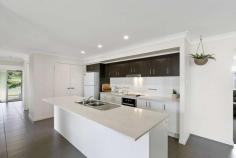  8B Jimilee Street Dundowran Beach QLD 4655 $499,000 Searching for a generous parcel of land and a home that allows the family to spread out, enjoy and slow life down a little, without being too far out of town? 8B Jimilee Street, Dundowran Beach is the perfect property for you. Perfectly positioned amongst other quality properties sits this well-presented modern home on a spacious 2,366m2 block with its own private lake frontage. If you are looking for a home which you can move in and enjoy straight away 8B Jimilee Street must be inspected, no work is required as property is just 3 years old. • 	 Master bedroom with ensuite and walk in wardrobe • 	 Additional three bedrooms in separate wing of house with own family room and bathroom • 	 Open plan kitchen and dining with formal lounge • 	 Modern kitchen with walk in pantry & stone bench tops • 	 Generous side access • 	 Landscaped gardens with garden walk through private lake and vine forest • 	 Split system air-conditioner to open plan living and family room Dundowran Beach is filled with quality homes and offers a safe and secure neighbourhood with a relaxed and friendly atmosphere. The local Dundowran Beach is only a short walk with many natural reserves, vine forests and lagoons to explore on your doorstep. Central Hervey Bay is only an eight-minute drive, all major conveniences such as shopping centres, schools, hospitals and the airport are within an easy drive. Should you have interest, please always feel welcome to contact Eli Winger on 0439 909 699 - the phone is on 7 days week. We look forward to assisting with all of your real estate needs. FEATURES: • 	 Air Conditioning • 	 Built-In Wardrobes • 	 Close To Shops • 	 Close To Transport • 	 Formal Lounge • 	 Garden • 	 Secure Parking 