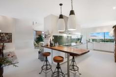  29-31 Hennessy Drive Dundowran Beach QLD 4655 $1.38 Mil Not just a home, but a living breathing environment. Bringing you the quintessential home for Queensland living... designed to capture all the elements of the location. Positioned high in prestigious Dundowran Beach, and sitting on a 3,486m2 allotment, this architecturally designed home has been thoughtfully constructed to create balance and harmony with a strong focus on sustainability and self-sufficiency. The best of modern 'green smart living'. The home is highlighted with many artistic features and a clever use of natural materials. From the repurposed ship wood front door on entry to the recycled rubber shingle roof imported from the U.S. Original designer pendant lighting throughout, handcrafted coloured glass windows and Blackbutt timber flooring all contribute to the detail and thought put into the design of this home. Rammed earth feature walls flow throughout, improving the thermal control & noise reduction. 29-31 Hennessy Drive is an inspirational home offering: Spacious entrance foyer connecting to the informal living and dining area North facing alfresco entertaining area with automatic retractable roof, designed to maximise use throughout the seasons Beautifully designed kitchen with granite stone benchtops, integrated Miele and Liebherr high performance appliances, walk in pantry and servery to the alfresco area Substantial parents retreat located upstairs, with separate lounge area, walk-in wardrobe, ensuite and private deck capturing the sea views and district outlook Three additional bedrooms, two with deck access and all uniquely appointed The study and spacious second living area give this home another secluded living zone Concrete chlorinated pool with mosaic tiling 15,000L rainwater tank underneath the house for servicing the garden Separate, two-bedroom, self-contained executive parents retreat, built to the same quality standards of the home With central Hervey Bay only an eight minute drive, all major conveniences such as shopping centres, schools, hospitals and the airport are within an easy drive. The local Dundowran Beach is only a short walk with many natural reserves, vine forests and lagoons to explore on your doorstep. The MULTI AWARD winning home needs to be inspected to truly be appreciated, call Marie or Eli to arrange an inspection. FEATURES: • 	 Built-In Wardrobes • 	 Fireplace(S) • 	 Garden • 	 Polished Timber Floor • 	 Secure Parking 