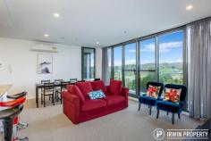  36/15 Irving Street Phillip ACT 2606 $499,000 Those looking for a home or investment property that offers access friendly features, genuine space, gorgeous views and resort style facilities are invited to inspect this stunning, as new apartment. THE HOME The large open plan living space consists of a lounge and dining area drenched in natural light from the generous floor to ceiling double glazed windows. Sliding doors lead out to the outdoor, covered balcony, the perfect spot to enjoy your favourite drink and enjoy its panoramic views. A chef's dream, the kitchen is beautifully finished with stone bench tops, generous storage and two-tone cabinets. Appliances are quality Smeg items including the induction cooktop. The European style hide-away laundry is integrated within the kitchen space and includes a washer/dryer. There are two full size bedrooms, at opposite ends of the apartment, adjacent to their own bathrooms. The main bedroom features a walk-in robe and second bedroom has a large built-in robe. The bathrooms are of standout quality with floor to ceiling tiling, generous storage & high-end finishes that will impress. Ensuring everyone is comfortable year-round are three Panasonic split system air conditioners. Secure basement parking is included for two vehicles, one being an extra wide accessible space, plus there's additional lockable storage. 'Ivy Woden' residents enjoy use of the rejuvenation centre with indoor and outdoor pools, a spa, sauna, separate weights and cardio gyms, both indoor and outdoor yoga spaces, an outdoor bowling green and outdoor entertaining/recreational areas. THE LOCATION 'Ivy Woden' is perfectly positioned, only minutes to Woden Town Centre including a number of major government agencies, Westfield Shopping Centre, Canberra Hospital, Calvary John James Hospital, public transport options plus a growing list of cafés and restaurants. The apartment is just 8km from the Parliamentary Triangle making cycling to work a breeze. 