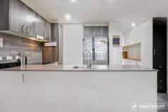  8/35 Oakden Street Greenway ACT 2900 $509,000 Located at street level with two entries including direct private access off Oakden Circuit, this immaculate two storey home, set over two levels, makes a compelling offering for the savvy investor, 'downsizer' or first home buyer. THE PROPERTY On the ground level, the apartment features a light-filled open plan living/dining area that adjoins the kitchen and opens out onto the paved enclosed courtyard. The sleek kitchen features an electric cooktop, electric oven, dishwasher, stone benchtops, soft close drawers and a full-length pantry. The design of the kitchen has been customised with the addition of extra cupboard and bench space, allowing for more room and storage options. The home cook will not be disappointed! Directly behind the kitchen, there is a separate sized laundry which leads out to the two undercover, allocated car spaces and storage. Upstairs, the main bedroom features a walk-in robe and ensuite with views to Lake Tuggeranong. The other bedrooms both include built-in robes and open onto a private courtyard with direct access to the pool. The property offers several storage options including a hall cupboard and extra enclosed space under the stairs which similar properties tend to lack. Other features include split system air conditioning units in the living area and main bedroom as well as double glazed windows. Living at ‘Southport’ means access to resort style facilities such as the 25m lap pool, plunge pool, fully equipped gym, sauna, rooftop & poolside outdoor entertaining areas. Please note: this property is currently rented for $580 per week on a periodic lease with a tenant who would be happy to stay. THE LOCATION This complex is popular with owners and tenants because it’s located so close to all the facilities Tuggeranong has to offer. If you walk out the front door, directly across the road you'll enjoy the newly opened ‘Two Before Ten’ cafe or cross at the other corner and you’ll be at the local Bunnings. The Tuggeranong Town Centre is three blocks away which means a short walk to major supermarkets and department stores, restaurants, cafes, medical services and a range of other services including access to public transport. The features don’t just stop at the apartment’s lake views, you’re also able to walk across the road directly to the Lake Tuggeranong foreshore and nearby Limburg Way playground.. 