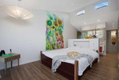  29-31 Hennessy Drive Dundowran Beach QLD 4655 $1.38 Mil Not just a home, but a living breathing environment. Bringing you the quintessential home for Queensland living... designed to capture all the elements of the location. Positioned high in prestigious Dundowran Beach, and sitting on a 3,486m2 allotment, this architecturally designed home has been thoughtfully constructed to create balance and harmony with a strong focus on sustainability and self-sufficiency. The best of modern 'green smart living'. The home is highlighted with many artistic features and a clever use of natural materials. From the repurposed ship wood front door on entry to the recycled rubber shingle roof imported from the U.S. Original designer pendant lighting throughout, handcrafted coloured glass windows and Blackbutt timber flooring all contribute to the detail and thought put into the design of this home. Rammed earth feature walls flow throughout, improving the thermal control & noise reduction. 29-31 Hennessy Drive is an inspirational home offering: Spacious entrance foyer connecting to the informal living and dining area North facing alfresco entertaining area with automatic retractable roof, designed to maximise use throughout the seasons Beautifully designed kitchen with granite stone benchtops, integrated Miele and Liebherr high performance appliances, walk in pantry and servery to the alfresco area Substantial parents retreat located upstairs, with separate lounge area, walk-in wardrobe, ensuite and private deck capturing the sea views and district outlook Three additional bedrooms, two with deck access and all uniquely appointed The study and spacious second living area give this home another secluded living zone Concrete chlorinated pool with mosaic tiling 15,000L rainwater tank underneath the house for servicing the garden Separate, two-bedroom, self-contained executive parents retreat, built to the same quality standards of the home With central Hervey Bay only an eight minute drive, all major conveniences such as shopping centres, schools, hospitals and the airport are within an easy drive. The local Dundowran Beach is only a short walk with many natural reserves, vine forests and lagoons to explore on your doorstep. The MULTI AWARD winning home needs to be inspected to truly be appreciated, call Marie or Eli to arrange an inspection. FEATURES: • 	 Built-In Wardrobes • 	 Fireplace(S) • 	 Garden • 	 Polished Timber Floor • 	 Secure Parking 