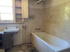  26/28 Burlong Rd Northam WA 6401 $145,000 Are you ready for a challenge? This Home is in need of a lot of love  Two titles totaling 1/2 acre  , one with a house on it and the other with the Garden shed and stand alone carport.  The house itself would have been an an original weatherboard and iron roof home , with Timber ceilings and Walls , it has had some extensions done since being built.    Currently it has 3 bedrooms  two living areas and a nice outdoor area, as well as a lovely front verandah.    Features include  Water and Power Connected  Wood fire  Pot belly  electric cooking  Electric Storage HWS  Chook pen Septic tanks .. 
