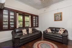  48 Harper St Woodbridge WA 6056 $569,000 The invitation of a deep front porch, an impressive, timber entry hall, leadlight pocket doors, decorative ceilings, and double casement windows will make anyone with vision, passion and a sense of romance swoon with delight at every turn. Built in the 1920s, with an air of quality, this 3 bedroom, 2 bathroom home has occupied its elevated corner lot with grace and beauty for almost 100 years and now awaits a new heart to enchant. • 	 3 bedrooms 2 bathrooms • 	 1920s-built character home • 	 Front porch to lrg entryway • 	 Studio, cellar, attic, garage • 	 Original jarrah floorboards • 	 Splendid leadlight windows • 	 Renovated kitchen/meals • 	 Formal lounge w built-ins • 	 Elevated 679m corner block • 	 Opposite Swan River Reserve Don’t miss the chance to restore this utterly charming home to its full glory. An abundance of original features and the initial builder’s quality features provide a persuasive outline of the magnificence waiting to be fully revealed. As you step into the entry hall, the depth of treasure that awaits is immediately apparent. A double-height ceiling, wide jarrah floorboards and panelled walls bring to mind old Hollywood movies where mildly chaotic families lived in grand craftsman-built homes. The timber panelling conceals a door leading to the secret cellar and separate, double undercroft garage. A staircase with deco-style balusters leads up to a long attic, used as the third bedroom, with views of the Swan River and foreshore reserve opposite. Pocket doors with leadlight panels open from the formal entry hall to reveal a lounge room with wide jarrah floorboards, an ornate recessed ceiling dome and deep-sill windows flanked by glass-fronted built-in Jarrah cabinets.  Well-proportioned rooms with high ceilings offer a framework throughout the home while original features bring inimitable character. The greatest joy of this property is that it has been little altered. As a result, double-hung sash windows, stained glass and lead lights, decorative architraves, bullnose corners and textured plaster are waiting to be restored to their former glory and take pride of place in a modern renovation with a rich heritage. The kitchen/meals area has been updated. Gleaming white tiles surround the original fireplace bringing a contemporary aesthetic without obscuring history.  A garden window offers a touch of whimsy and vintage style while the open-plan layout and split system A/C is a nod to modern sensibilities. Two large bedrooms sit to either side of the end of a central hallway. Bullnose corners create a sense of space by opening the hallway and allowing for easy movement between the bedrooms and the family bathroom. The main bedroom features a decorative ceiling, picture rail and double sash windows looking onto the front garden. The adjoining ensuite, with shower, vanity and W.C. is a more modern addition. In the second bedroom, a leadlight window, high ceilings and timber floors fashion a flexible room that will delight children of all ages and is large enough to share. The family bathroom includes an over-tub shower, vanity and W.C. A stand-alone studio with a kitchenette and bathroom sits to one side of a central lawn. This multi-purpose space has previously been utilised as a guest suite and teens’ retreat. A central lawn edged with raised garden beds separates the studio from the home’s original outbuildings sitting at the property’s eastern boundary. With a desirable, elevated, corner location opposite the Swan River and foreshore reserve, and set within walking distance of Guildford Grammar and Woodbridge Train Station, this property is well placed for the present and the future. Outside of the Woodbridge Conservation zone and not heritage listed, the property does not place restrictions on your imagination or desires.  Integrate the integrity of the original architectural features with your personal requirements and reawaken this remarkable family home. Blending a sense of adventure and a splash of surprise with a sprinkle of magic, the irresistible lure of this property is undeniable. To arrange an inspection of this property or for friendly and honest assistance with any of your real estate needs, call Mr Happy – Ross Webster – 0407 387 004. 