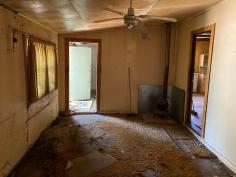  26/28 Burlong Rd Northam WA 6401 $145,000 Are you ready for a challenge? This Home is in need of a lot of love  Two titles totaling 1/2 acre  , one with a house on it and the other with the Garden shed and stand alone carport.  The house itself would have been an an original weatherboard and iron roof home , with Timber ceilings and Walls , it has had some extensions done since being built.    Currently it has 3 bedrooms  two living areas and a nice outdoor area, as well as a lovely front verandah.    Features include  Water and Power Connected  Wood fire  Pot belly  electric cooking  Electric Storage HWS  Chook pen Septic tanks .. 