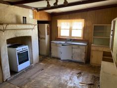  26/28 Burlong Rd Northam WA 6401 $145,000 Are you ready for a challenge? This Home is in need of a lot of love  Two titles totaling 1/2 acre  , one with a house on it and the other with the Garden shed and stand alone carport.  The house itself would have been an an original weatherboard and iron roof home , with Timber ceilings and Walls , it has had some extensions done since being built.    Currently it has 3 bedrooms  two living areas and a nice outdoor area, as well as a lovely front verandah.    Features include  Water and Power Connected  Wood fire  Pot belly  electric cooking  Electric Storage HWS  Chook pen Septic tanks .. 