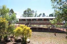  43276 Burnett Highway Jambin QLD 4702 $330,000 3.14 hectares - 7.75 acres would be the perfect option. Located just 19 minutes' drive from Biloela at the locality of Jambin. School bus stop at the front gate to Jambin primary and all Biloela schools. The high-set residence with polished timber floors throughout and featuring 5 bedrooms all with built-in robes. Main with air-conditioning. Separate air-conditioned lounge, large kitchen and dining that opens onto the 8m x 5.5m* timber deck. Separate office area with NBN internet installed. The house is 2.5* metres above the ground which enables the home to be concreted under within council guide lines. Enclosed colourbond shed 60 m* x 6 m* with 2 skillions providing car and machinery storage. Water is supplied from an electric equipped bore that supplies taps throughout the gardens, the chook pen, cattle trough and the house. 30,000* gallons of rainwater from 4 poly tanks. The grazing paddock is subdivided into 2 paddocks and is perfect for horses or cattle. Private inspections available upon request. *Approx FEATURES: • 	 Air Conditioning • 	 Built-In Wardrobes • 	 Close To Schools • 	 Close To Transport • 	 Polished Timber Floor 