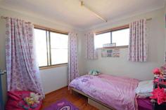  43276 Burnett Highway Jambin QLD 4702 $330,000 3.14 hectares - 7.75 acres would be the perfect option. Located just 19 minutes' drive from Biloela at the locality of Jambin. School bus stop at the front gate to Jambin primary and all Biloela schools. The high-set residence with polished timber floors throughout and featuring 5 bedrooms all with built-in robes. Main with air-conditioning. Separate air-conditioned lounge, large kitchen and dining that opens onto the 8m x 5.5m* timber deck. Separate office area with NBN internet installed. The house is 2.5* metres above the ground which enables the home to be concreted under within council guide lines. Enclosed colourbond shed 60 m* x 6 m* with 2 skillions providing car and machinery storage. Water is supplied from an electric equipped bore that supplies taps throughout the gardens, the chook pen, cattle trough and the house. 30,000* gallons of rainwater from 4 poly tanks. The grazing paddock is subdivided into 2 paddocks and is perfect for horses or cattle. Private inspections available upon request. *Approx FEATURES: • 	 Air Conditioning • 	 Built-In Wardrobes • 	 Close To Schools • 	 Close To Transport • 	 Polished Timber Floor 