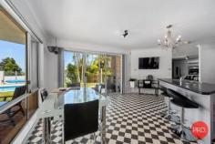 19 Anniversary Place COFFS HARBOUR NSW 2450 $1,400,000 This 3 level contemporary residence is ideally positioned to capture the views over Coffs city and out to the ocean and beyond. Every detail has been thought of with loads of space set over three levels. Living areas are encased by full-length sliding doors opening onto expansive balconies enhancing the feeling of a holiday location. There are 7 bedrooms, 3 bathrooms plus a powder room and multiple living areas as well as a huge theatre room. On the top level there is a 50m² parent's retreat with fabulous views right out to the ocean. Downstairs there is guest accommodation ideally suited to Airbnb that is fully self-contained and has its own courtyard backing onto a National Park. Relax and enjoy a huge heated swimming pool that is self cleaning, with surrounds ideal to entertain with friends and have a cool drink. This home has a 5,000 Litre underground water storage tank, Solar electricity panels, security system alarm and reverse cycle air conditioning. 