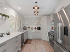  12 Poets Corner NERANG QLD 4211 $669,000 Nestled at the end of a peaceful cul-de-sac in a leafy neighbourhood this striking home with plenty of off street parking is surrounded by an abundance of birdlife and parklands all at your back door. No expense has been spared and will be obvious as you take a walk through this fully rejuvenated home. Apart from the separate double lock-up garage there is a big undercover motorhome accommodation so just lock up and head off on your family holiday. For the entertainers there is a massive entertaining area for the biggest of gatherings flowing out from the spacious kitchen. Relax all year round with your large luxury temperature controlled spa bath in private undercover outside area. The location is superb with schools and shopping so close. Whether you're going out into the night life of the Gold Coast or a Sunday drive to Mount Tamborine, both are just a 20 minute drive from your front door. Features include: Two separate living areas, air conditioning, ceiling fans, entertaining area, motorhome accommodation, solar 6kw, leaf guard, spa bath, double lock-up garage (auto), gas cooktop. 