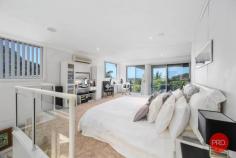  19 Anniversary Place COFFS HARBOUR NSW 2450 $1,400,000 This 3 level contemporary residence is ideally positioned to capture the views over Coffs city and out to the ocean and beyond. Every detail has been thought of with loads of space set over three levels. Living areas are encased by full-length sliding doors opening onto expansive balconies enhancing the feeling of a holiday location. There are 7 bedrooms, 3 bathrooms plus a powder room and multiple living areas as well as a huge theatre room. On the top level there is a 50m² parent's retreat with fabulous views right out to the ocean. Downstairs there is guest accommodation ideally suited to Airbnb that is fully self-contained and has its own courtyard backing onto a National Park. Relax and enjoy a huge heated swimming pool that is self cleaning, with surrounds ideal to entertain with friends and have a cool drink. This home has a 5,000 Litre underground water storage tank, Solar electricity panels, security system alarm and reverse cycle air conditioning. 
