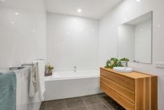  57 Glen Lossie Street Woodville South SA 5011 $700,000 to $770,000 Enjoying a fabulous position among the prestigious ‘Glens’ of Woodville South, this brand new two-storey home is superb from start to finish. It’s the little luxuries that make this Torrens Title build townhome when it comes to selection. A huge ground floor master bedroom suite is easily accessible from the extra wide entry, where its northerly aspect welcomes a constant soaking of natural light, and a large walk-in robe and Spotted Gum dual-vanity ensuite bathroom add extra comfort. Created for entertaining, the open plan kitchen, living and dining is well-lit, inviting and intricate. A stunning American Oak topped waterfall island adds warmth to the sleek white cabinetry and textured tile splash back that will have any home chef itching to get into this kitchen. Complete with Bosch stainless steel appliances including a 900mm gas cooktop, wall oven and dishwasher, butler’s pantry, breakfast bar and wealth of storage. The living space with feature gas wood log fire will be the place to be as winter approaches, while dual sets of sliding doors allow for easy access to a hardwood rear decked alfresco and side courtyard with lawn. Head up the Tasmanian Oak staircase and you’ll be pleasantly surprised by the size of a second living space or kids’ retreat, as well as a further three bedrooms including huge front double with built-in robes that would happily convert to a home office or third living space. Serviced by a large family bathroom with bath and shower, along with full-height storage to the passage that is sure to come in handy. Delight in the details: – Solid 19mm timber floors upstairs – Huge wraparound understair storage – Double length carport – Ducted reverse cycle air conditioning – Spacious laundry + third w/c to ground floor – Walk-in robes to bedrooms 3 & 4 Just over 10-minutes to the CBD, with commutes made easy via train and bus transport. Schools, shops, hotels, reserves and the sea – they’re all within easy reach here. Quality and total comfort, this one will be hard to resist. 
