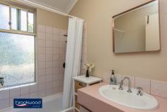  45 Inquirer Lane Stratton WA 6056 $329,000 What a find for first home buyers and downsizers. This 4-bedroom, 2-bathroom brick and tile home sits hidden on a winding lane and overlooking a grove of tall jacarandas. Set well back from the road with a fully fenced back yard offers extensive space for outdoor living, a lawn, and a small garden shed. • 	 4 bedrooms 2 bathrooms • 	 1995-built brick and tile • 	 Formal & informal living • 	 Good sized jnr bedrooms • 	 Open plan kitchen/family • 	 Carport with roller door • 	 Separate dining/activity • 	 Extensive outdoor living • 	 451 sqm fully fenced lot • 	 Hidden in a green glade Not only does this home deliver a flexible floor plan, good sized bedrooms and ample space for outdoor living, but the delightful setting also overlooks a stand of tall jacarandas with their seasonal display of purple exuberance and lush green canopy. An elevated position well back from the road adds to the sense of seclusion; it’s hard to believe schools, local shops, transport, and the Midlands CBD are mere minutes away. The front door opens into a formal lounge with reverse cycle air conditioning. This quiet, carpeted space is ideal for curling up with a book or enjoying uninterrupted screen time. Opposite the lounge is the good-sized main bedroom featuring built-in robes and an ensuite with shower, vanity and W.C. A central open plan kitchen/family room flows seamlessly to a south-facing verandah and decked gazebo to allow for effortless indoor-outdoor living. A U-shaped bench with an integrated breakfast bar and under bench storage delineates the well-designed kitchen. A cutaway wall creates a partial separation between the kitchen/family room and a formal dining room or activity space. This air-conditioned, multi-purpose room leads to the junior wing where three good sized bedrooms, two with robe recesses, share the family bathroom and a separate W.C. located off the walk-through laundry. A decked gazebo overlooks a small lawn and wide verandah in the fully fenced backyard, allowing ample space for entertaining or relaxing. A small garden shed sits in the far corner of the yard. The memorable setting, private backyard and sense of space create a delightful feeling that you have left the world behind. Yet, the convenient Stratton address puts shops, schools, public transport, and the Perth Hills’ outdoor adventures on your doorstep. To arrange an inspection of this property or for the best advice, the best service and the best solutions call Ken Wiggins on 0403 012 950. 