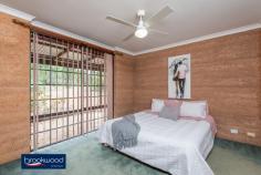  42 Blackboy Way Morangup WA 6083 $499,000 Embrace a life close to mother nature in this rammed earth, homestead-style property set on 5-acres. Organic textures and tones ensure the home sits lightly within its natural landscape and bring a delightful calm to the interior spaces. A central open plan leading to separate adult and junior wings forms a practical floorplan. Wide verandahs, a below ground pool, and a 6 m x 9 m shed offer ample inducement to outdoor living and a delightful sense that all you need is right here. • 	 4 beds, 2 baths + study • 	 1994-built rammed earth • 	 Central open plan design • 	 Separate bedroom wings • 	 Wide paved verandahs • 	 6m x 9 m Colorbond shed • 	 Below ground swim pool • 	 Pool house/games room • 	 5-acres productive bore • 	 Space, seclusion, nature Warm, earth tones and the organic texture of rammed earth construction create a home that blends effortlessly with its surroundings. Set towards the centre of the 5-acre lot, a sense of privacy and space descends as soon as you enter the property. A double front door entryway is flanked by an open plan kitchen/meals/family room and a spacious, carpeted lounge. With easy-care, timber-look floors, a slow combustion fireplace (with a wetback to heat water during winter), a gas bayonet, and reverse cycle air-conditioning, the flexible open plan area is sure to be at the heart of family life. A subdued atmosphere fills the carpeted lounge, a spacious and inviting space to enjoy at-home movie and games nights. This formal space creates a transition between the open plan area and the privacy of the principal suite. The main bedroom is a generous size with a walk-through wardrobe leading into an ensuite with shower, vanity and W.C. Earthen walls and soft carpets fashion a calm retreat away from the activity of the central living zone. This separation from the home’s busy, shared spaces makes the adjoining home office ideal for uninterrupted work or study. A separate junior wing, comprising three good sized rooms – two with built-in robes – a shared bathroom with bathtub, vanity and shower, and a walk-through laundry with a separate W.C. completes the interior floorplan. Paved verandahs at the front and rear of the home offer a choice of outdoor living areas with garden views to the front and poolside convenience to the rear. The below-ground salt pool is surrounded by a small lawn and offers views of the tree canopy while floating. A pool house/games room expands the outdoor living space. At the property’s southern boundary, a 6 m x 9 m Colorbond shed with a concrete pad and potbelly stove is waiting to be transformed into an enviable man cave. Those who yearn to live close to nature will discover the peace and tranquillity of life surrounded by open space and a home that blends beautifully with its setting. The power of this rural paradise is so beguiling that you may never want to leave. However, access to a school bus route and Toodyay Road mean the rest of the world is there when you want it. To arrange an inspection of this property, call Cheryl New on 0439 961 192. 