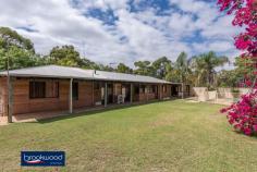  42 Blackboy Way Morangup WA 6083 $499,000 Embrace a life close to mother nature in this rammed earth, homestead-style property set on 5-acres. Organic textures and tones ensure the home sits lightly within its natural landscape and bring a delightful calm to the interior spaces. A central open plan leading to separate adult and junior wings forms a practical floorplan. Wide verandahs, a below ground pool, and a 6 m x 9 m shed offer ample inducement to outdoor living and a delightful sense that all you need is right here. • 	 4 beds, 2 baths + study • 	 1994-built rammed earth • 	 Central open plan design • 	 Separate bedroom wings • 	 Wide paved verandahs • 	 6m x 9 m Colorbond shed • 	 Below ground swim pool • 	 Pool house/games room • 	 5-acres productive bore • 	 Space, seclusion, nature Warm, earth tones and the organic texture of rammed earth construction create a home that blends effortlessly with its surroundings. Set towards the centre of the 5-acre lot, a sense of privacy and space descends as soon as you enter the property. A double front door entryway is flanked by an open plan kitchen/meals/family room and a spacious, carpeted lounge. With easy-care, timber-look floors, a slow combustion fireplace (with a wetback to heat water during winter), a gas bayonet, and reverse cycle air-conditioning, the flexible open plan area is sure to be at the heart of family life. A subdued atmosphere fills the carpeted lounge, a spacious and inviting space to enjoy at-home movie and games nights. This formal space creates a transition between the open plan area and the privacy of the principal suite. The main bedroom is a generous size with a walk-through wardrobe leading into an ensuite with shower, vanity and W.C. Earthen walls and soft carpets fashion a calm retreat away from the activity of the central living zone. This separation from the home’s busy, shared spaces makes the adjoining home office ideal for uninterrupted work or study. A separate junior wing, comprising three good sized rooms – two with built-in robes – a shared bathroom with bathtub, vanity and shower, and a walk-through laundry with a separate W.C. completes the interior floorplan. Paved verandahs at the front and rear of the home offer a choice of outdoor living areas with garden views to the front and poolside convenience to the rear. The below-ground salt pool is surrounded by a small lawn and offers views of the tree canopy while floating. A pool house/games room expands the outdoor living space. At the property’s southern boundary, a 6 m x 9 m Colorbond shed with a concrete pad and potbelly stove is waiting to be transformed into an enviable man cave. Those who yearn to live close to nature will discover the peace and tranquillity of life surrounded by open space and a home that blends beautifully with its setting. The power of this rural paradise is so beguiling that you may never want to leave. However, access to a school bus route and Toodyay Road mean the rest of the world is there when you want it. To arrange an inspection of this property, call Cheryl New on 0439 961 192. 