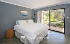  32 Kangaroo Parade Yallingup WA 6282 $1,300,000 to $1,400,000 Situated just a three minute drive from both Smiths and Yallingup beaches, this four bedroom, two bathroom, solar passive, brick and Colorbond home is tucked away on 2.7 acres of peppermint, banksia and redgum bushland. Just a short walk to Studio Bistro and Little Fish restaurants and a two minute drive to Yallingup General Store and Caves House Hotel. This versatile four bedroom home has an open plan living, kitchen, dining area with raised ceilings and a slow combustion wood heater. A generous separate lounge area has an open fireplace. All rooms have bushland outlooks. The living areas and main bedroom face north for winter sun and open out onto a freestanding alfresco area. The home also has a large games room/workshop accessed from the double garage or verandah. The succulent gardens are low maintenance. The bushland has stunning wildflowers in spring including orchids. The home has a fully reticulated vegetable garden and established fruit trees. Water for gardens is supplied by a bore. There is plenty of room for visitor’s cars, caravans and tents. If you are chasing a secluded home or holiday house on acreage close enough to the beach for a morning swim, surf check or evening sunset walk then this is the property for you. Additional Features: * 1.1022ha (approximately 2.7 acres) * 2 x split system air conditioners (living area and games room) * Solar hot water system with electric hot water booster * 13 panel solar system * Huge rain water tank * Bore with self-filling holding tank * 3 huge shade sails between house and freestanding alfresco area * 900mm rangehood, gas hotplate and 600mm oven * Large walk-in pantry * 2002 brick and Colorbond construction * Room to add sheds, granny flat or extensions (subject to approval) * Fenced vegetable gardens * Established fruit trees * Garden shed * Shade house For further information or to arrange inspection please contact your South West Sales Representative Ben Jecks on 0408 545 304 or ben@jmwrealestate.com.au 
