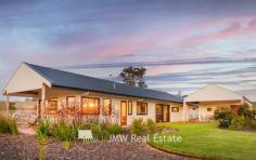  36 Hazelbrook Rise YALLINGUP WA 6282 $1,795,000 This four bedroom home is unique in so many ways and has also been carefully and thoughtfully designed to accommodate comfortable family living. The 1.565ha (3.8 acre) lot is the pick of the location being at the end of the cul-de-sac with panoramic views over rolling hills, valleys, a tree lined creek, vineyards and out to the Leeuwin Naturaliste Ridge. Features include: * 160k litre water tank * Extensive use of Bunbury jetty timbers and recycled brick pavers * Concrete floors with low VOC sealer * Marri benchtops and day bed sourced from trees on the block * Extensive storage throughout * 900mm Smeg oven and stove * Smeg dishwasher * Double glazing * No VOC paints internally * Wall panels are an eco product with no VOC’s * Rustic playground made from jetty timbers * 2000 native trees and shrubs planted * 20 mixed olive trees planted * Hear the ocean on still winter nights * Ocean glimpses around the block * Highly efficient Yunca Xander fire with 10 hour burn time * Fenced veggie beds * Huge pantry * Concrete render and pressed tin on the bathroom walls * All minor bedrooms are large * Four undercover patio areas (somewhere to go in any wind) * Petrol fire fight pump installed with long hose * Solar hot water * Large carport with built-in shed and bike shed * Peaceful and quiet yet close proximity to Yallingup * Close to beautiful Smiths beach * Registered as a holiday home (Shire requires new owners to re-register) can pass on the $2k bushfire management and evacuation plan As soon as you enter the residences you become aware of the feeling of the architecture blending into the natural landscape and environment. The very well appointed kitchen seamlessly meets with the dining area and then to the spacious light filled living room. The built-in slow combustion wood heater ensures you have the warmth and comfort to enjoy the winter months when the countryside pastures turn to a brilliant green. The master bedroom is well placed at the rear of the home and features a well designed en-suite, outside shower and bath with magnificent and varied views of the surrounding countryside. The three minor bedrooms are all generous in size and also have beautiful vistas served by a large bathroom with separate bath and shower. Parking includes a double carport with extra gravel paved areas for guest parking, trailers or boats and a workshop attached to the rear of the carport. The outside areas allow for entertaining through different seasons and weather conditions creatively landscaped with brick paving, lawns and vegetable gardens. The property and residence would suit family living and also be an ideal holiday home to retreat to from the pressures and stress of a busy city life. 