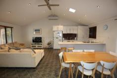  97 Goldfields Road Castletown WA 6450 $395,000 Set behind a solid yet stylish feature wall, this 4 bedroom, 2 bathroom home is ready to walk in and enjoy. Raked ceiling with down lights gives a spacious feel to the kitchen/living/dining with reverse cycle air-conditioning, ceiling fan and tile fire. Dining room leads out to large decked patio with a door opening up to a double bedroom with ensuite. Bedrooms have built-in-robes, two with ceiling fans. Concrete driveway leads to rear double garage with lean to, gazebo, aviary and chook yard. 