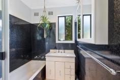  755 The Entrance Road Wamberal NSW 2260 From its funky coastal vibe to its idiosyncratic design, why live life to the norm when you can express your individuality here whilst sampling a lofted panoramic outlook for the ultimate in escapism. An harmonious atmosphere is evident from the moment you walk to the door, with a blend of chill out zones extending from inside to out. The entry deck provides a welcoming nook for that early morning coffee start outdoors, the lounge room that surprisingly becomes a soothing space where double glazed windows and doors help nullify any outside noise, the sun filled rear north east facing entertaining deck with a scenic outlook that implores alfresco living, and for that pinnacle place to retreat to then venture upstairs to the studio space with another lounge deck to unwind on whilst admiring the widespread ocean views. Add to this a retro inspired kitchen, a bathroom that is true testament to a bygone era, groovy spiral staircase and charming laminate timber floors throughout and it’s easy to see what sets this home apart. There’s also a six foot high fence at the front for extra privacy, lock up garage, plus additional car parking bay which also makes a handy turn around space to safely exit on to the street. Only a two minute walk to shops, bus stop close buy, or three minutes drive to Wamberal beach. If you dare to be different then don’t you dare miss this. OPEN FOR INSPECTIONS: Please be mindful parking at this property is very limited, best parking options are Reads Road or behind the shops on Ghersi Avenue. 