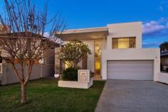  59B Dunkley Ave Applecross WA 6153 Crafted to cater for a wide variety of lifestyles, this sleek and sophisticated residence is architect-designed and ideally-located opposite Tompkins Park, with the Applecross riverfront foreshore, cycle paths, and recreation facilities only a stone’s-throw away. From the ground-floor master bedroom to the multiple living areas, this is an easy-care residence with generous room sizes and plenty of space to build happy memories! The ground-floor open plan dining and family area adjoins twin sets of glass bi-fold doors that provide direct access to a private outdoor entertaining space that features an undercover alfresco with built-in BBQ and kitchenette and swimming pool surrounded by sleek Modwood decking, all surrounded by easy care gardens. Central to the ground-floor, the kitchen features stone benchtops with waterfall edges, zip tap, a walk-in pantry, double plumbed-in refrigerator recess, and an abundance of storage. The master bedroom suite is positioned on the ground floor and has direct access to the backyard. This luxurious suite features a generous walk-in robe, modern en-suite with full-height tiling, stone benchtops, twin vanities, a hobless shower recess, and a freestanding bath. On the first-floor of the home, an additional area adjoins a balcony with a parkland vista, perfect for teenage children to entertain themselves and their friends. There is also four minor bedrooms all with built-in robes. The main bathroom offers twin vanities, and a separate freestanding bath and W/C. Bringing everything together within this modern residence is Blackbutt timber flooring, ducted reverse-cycle air conditioning, understair storage, and high ceilings with shadowline cornicing. Other features include a large laundry (with chute), separate ground-floor powder room, reticulated landscaping, two hot water systems, entry foyer with a high ceiling void, and an oversized double lock-up garage with shopper’s entry and rear pedestrian access. If lifestyle, convenience, and location are your priorities, you simply must inspect this home! For further information, please contact Renee Banovich on 0409 647 341, or Ryan Constantine on 0408 905 138. 