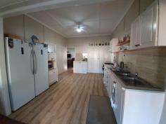  3 CHESTERLE STREET BLACKBUTT QLD 4314 $269,000 Welcome to this newly renovated 2 bedroom home, set on 1012sqm town block. The home has been freshly painted inside, with new vinyl cladding outside, new windows & security screens, with timber look ,vinyl flooring throughout. This home has a front sunroom, reverse cycle air con in the lounge room & an internal craft room & laundry. The large modern kitchen has a gas stove with plenty of cupboard space & room for the table & chairs. Outside has a 2 bay carport & a carport for a large van/caravan, with a lock up container for the tools. Take in the warm morning sun on the large rear deck and entertain or have a B-B-Q.The furniture is neg.The garden is well established & very tidy. 