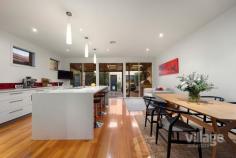  35 John Liston Dr Newport VIC 3015 $1,150,000 - $1,250,000 The entertainer’s delight Entertaining will be a dream in this sleek, large 3-bedroom family home located in the highly sought-after Williamstown Junction. You’ll be toasty warm from the moment you walk in with the gas log heater welcoming you into the large front lounge room which includes French doors that open out to the front courtyard. Follow the stunning timber floors, past the peaceful sounds of a waterfall in the enchanting atrium, to the spacious living area. A huge modern kitchen with a motherload of cupboard space and walk in pantry, includes stainless steel Miele appliances and a large Caesarstone island bench just itching for entertaining. Your dinner guests can relax in here or wander out to the huge alfresco wooden decking area, covered and fitted with its own bar heating and cafe blinds, offers enjoyment all year round. Head upstairs and you’ll find two good sized bedrooms with BIRs, one with a split system, both sharing a large bathroom with shower, toilet and bath as well as the light filled master bedroom with a walk-in robe, split system and ensuite with spa bath, shower and toilet. Fling open the French doors each morning to greet the sun from your very own petite balcony or just enjoy the views of the park across the road. As if all that is not enough, this house features ducted heating throughout, along with three split systems and evaporative cooling keeping it comfortable all year round, and Bose speakers with surround sound just ready for your amp to be plugged in. A large rear access double garage and, wait for it, ladder leading to a massive loft with oodles of storage space to hide away everything that comes with family living are just the icing on the cake. Situated minutes walking distance from the bustling Newport shops and cafes, 10 minutes from schools and 7 minutes to Newport train station - you couldn’t be closer to the action. The only problem you’ll have is where to sit peacefully with your glass of red, cheese and crackers - the lounge? The atrium? The deck? The balcony? The choice is yours... Features: • Spacious modern kitchen with Miele appliances • Large indoor/outdoor decking • Built in BBQ with rotisserie • Two bedrooms with BIRs • Master bedroom includes ensuite with spa bath and WIR • Atrium with water feature • Separate spacious laundry • Gas log and ducted heating • Split systems and evaporative cooling • Low maintenance outdoor spaces • Double garage with huge loft storage space • Lush green park, playground and tennis court across the road • Walking distance to shops, train station and schools.. 