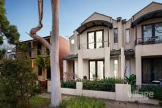  35 John Liston Dr Newport VIC 3015 $1,150,000 - $1,250,000 The entertainer’s delight Entertaining will be a dream in this sleek, large 3-bedroom family home located in the highly sought-after Williamstown Junction. You’ll be toasty warm from the moment you walk in with the gas log heater welcoming you into the large front lounge room which includes French doors that open out to the front courtyard. Follow the stunning timber floors, past the peaceful sounds of a waterfall in the enchanting atrium, to the spacious living area. A huge modern kitchen with a motherload of cupboard space and walk in pantry, includes stainless steel Miele appliances and a large Caesarstone island bench just itching for entertaining. Your dinner guests can relax in here or wander out to the huge alfresco wooden decking area, covered and fitted with its own bar heating and cafe blinds, offers enjoyment all year round. Head upstairs and you’ll find two good sized bedrooms with BIRs, one with a split system, both sharing a large bathroom with shower, toilet and bath as well as the light filled master bedroom with a walk-in robe, split system and ensuite with spa bath, shower and toilet. Fling open the French doors each morning to greet the sun from your very own petite balcony or just enjoy the views of the park across the road. As if all that is not enough, this house features ducted heating throughout, along with three split systems and evaporative cooling keeping it comfortable all year round, and Bose speakers with surround sound just ready for your amp to be plugged in. A large rear access double garage and, wait for it, ladder leading to a massive loft with oodles of storage space to hide away everything that comes with family living are just the icing on the cake. Situated minutes walking distance from the bustling Newport shops and cafes, 10 minutes from schools and 7 minutes to Newport train station - you couldn’t be closer to the action. The only problem you’ll have is where to sit peacefully with your glass of red, cheese and crackers - the lounge? The atrium? The deck? The balcony? The choice is yours... Features: • Spacious modern kitchen with Miele appliances • Large indoor/outdoor decking • Built in BBQ with rotisserie • Two bedrooms with BIRs • Master bedroom includes ensuite with spa bath and WIR • Atrium with water feature • Separate spacious laundry • Gas log and ducted heating • Split systems and evaporative cooling • Low maintenance outdoor spaces • Double garage with huge loft storage space • Lush green park, playground and tennis court across the road • Walking distance to shops, train station and schools.. 