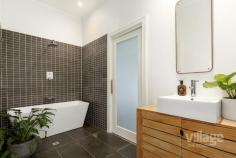  40 Pentland Parade Seddon VIC 3011 $1,250,000 - $1,350,000 Once a grocer, then a dressmaker, now a unique family home Sip your coffee on the doorstep and be part of Seddon life as it ambles by. The hub of this home is the former shop with its high ceilings, original brickwork, fireplace and remnants of bygone shelving. Flowing from an industrial warehouse style kitchen and living area are three bedrooms and two bathrooms each with their own charm and pops of colour. Bifold doors open the home to a spacious outdoor decking and entertainment area. Garden, off-street parking or extended yard then flow through to the bluestone laneway where horse and cart once delivered meat to the next-door butcher. The depth of this property and its spaces provide a variety of options to live in and enjoy. Equidistant from vibrant Seddon and Yarraville villages, and a stone’s throw from eclectic Footscray, deciding which way to stroll creates a welcome dilemma (or just don’t decide and step across the railway line to Fig & Walnut cafe). Gliding from the front door to nearby Seddon Station, the CBD feels like it is in touching distance. With the coming elevated veloway from Yarraville Gardens soon to provide an express route for two wheels, feet or skates, the sense of relaxed access to Melbourne’s heart will only grow. Part of a grouping of traders since 1890, the property comes embedded with a feeling of place and community. 