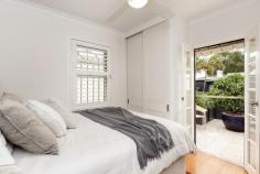  75 Greens Rd Paddington NSW 2021 Original period features abound throughout this beautifully & recently renovated terrace situated between Paddo’s favoured hubs, as well as Surry Hills, Moore Park playing fields and the city centre. A sought after position in a wide street with easily accessible street parking. Private rear-lane access to a sunny open courtyard - an elegant oasis. Features Include: + Stylishly appointed formal and informal living spaces + Polished timber floors with underfloor heating, freshly painted interiors & exteriors + Travertine stone floors in kitchen, bathroom, rear living area + High-end architect-designed kitchen with 50mm Ceaserstone bench and Smeg gas cooktop and oven + Main bedroom boasts French doors to private covered balcony + All chic bedrooms with built-in robes, rear opens to elevated sit out courtyard/garden + 2 bathrooms, stylishly skylit main bathroom + Entry hall, wine cellar/plenty of storage, office alcove with tallowwood bench + New sewerage, plumbing, electrical including rooftop TV antenna, NBN installed + Wide street opposite Victoria Barracks, located centrally to all transport and Oxford Street’s café and fashion shopping precinct.. 