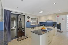  23 GRACE AVENUE POINT CLARE NSW 2250 Perfectly located in a quiet and central neighbourhood, this beautifully presented home has been thoughtfully designed with a functional and versatile layout, offering the ultimate in space, privacy and convenience. Boasting high raked ceilings; large, light filled rooms; multiple indoor/outdoor living and entertaining zones and parking for 4 cars; this is a dream home for large families. Central to the home and cleverly connecting everything is the large kitchen with gas cooking and loads of storage. From here, you are spoilt for choice with two separate indoor living areas and a dining room plus a huge outdoor living and dining space with built-in BBQ and pizza oven. An impressive master suite complete with walk-in robe and en suite, and its own access to the back yard, offers the perfect parent’s retreat. With the water’s edge, shops, transport and highly reputable Point Clare Public School just minutes away, this sought-after address won’t be on the market long. Property features: - Rendered brick and tile home with modern extension - High raked ceilings with exposed beams - Huge and private master suite with walk-in robe and en suite - Three double bedrooms with built-in robes - Huge family bathroom with floor-to-ceiling tiles and luxurious bathtub - Three-way kitchen with stone benchtops, 6-burner gas stove and storage galore - Impressive, all-season outdoor living and entertaining space with built-in BBQ - Beautifully established gardens and a secure and private back yard with outdoor pizza oven - Double garage with additional off-street parking for 2 cars - Under-house storage, water tanks and solar panels - A level walk to the park, walking/bike track and Brisbane Water - 2 minute drive to Point Clare train station, shopping village and Public School - 6 minute drive to M1 Motorway to Sydney and Newcastle.. 