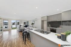  41/1 Arthur Blakeley Way Coombs ACT 2611 This spacious 4 bedroom multi-storey townhouse is located in the super convenient suburb of Coombs and provides both lifestyle and location, offering quality finishes and inclusions throughout. The home offers a light filled large open plan living area with the elegance of floating timber floors and a sleek, oversized kitchen with stainless steel AEG appliances including a dishwasher, gas cooktop and loads of bench space. Boasting spacious bedrooms, all with built in robes, you will have both space and comfort throughout this home. Complete with split system heating and cooling in the living areas and master bedroom. The convenient floor plan features a separate bathroom with bathtub and powder room to the upper level of the home, with ground level offering a separate laundry and additional powder room ideal for you family and visitors alike. Enjoy the outdoors with two separate spaces: a front courtyard and large outdoor covered patio area, perfect for entertaining all year round. For added convenience the generous oversized double garage includes loads of storage space and internal access, with storage and car parking both well catered for. Situated in a fantastic location of the peaceful Molonglo Valley district of Canberra, within close proximity to Charles Weston School, Molonglo Foreshore Park, Stromlo Forest Park and just a short drive to Cooleman Court Shopping Centre and Denman Prospect local shops with an array of cafes and restaurants. Features of the property include: Multi-storey home Large open plan living area 4 bedrooms Master bedroom with ensuite and views towards the Arboretum Reverse cycle air conditioning to living & master bedroom Study nook Modern sleek kitchen with high-quality AEG appliances and stone bench top Floating timber floors to the living area Oversized double garage with internal access, separate toilet and ample storage Two outdoor areas - large balcony with views of Mount Stromlo and fenced front courtyard.. 