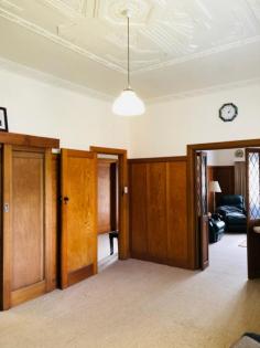  12 Foster Rd Fish Creek VIC 3959 $589,000 This substantial residence harks back to a bygone era - packed with period features and even including servants quarters, offering fabulous potential for many options. Zoned township surrounded by almost 3/4 of an acre (2430m2), close to the turn off to the iconic Wilsons Prom and pristine coastline. Timber paneling, diamond paned leadlights, ornate ceilings and large rooms offer renovation potential. Formal living and dining, modernized country kitchen. 3 bedrooms and easy access bathroom plus second living area with adjoining bedroom and bathroom - ideal for B&B use. Covered outdoor patio, LU double garage / workshop and parking for multiple cars. Solar and mains power, town and tank water. Easy stroll to the Great Southern Rail Trail, cafes and galleries of this quirky village. Inspections as advertised or by prior appointment only. 