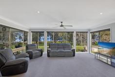  141 Lakedge Avenue Berkeley Vale NSW 2261 Serenity and space come together in this unique residence that not only offers an idyllic location, but also the versatility to accommodate a home business opportunity. Discretely tucked away from the street, adjoining waterfront reserve with views across the lake, vast window space maximises the outlook ensuring almost every room never feels enclosed. The property is ideal for those seeking space to spread both inside and out, with close to a ¼ acre of land and a flexible floor plan over two levels to cater for extended family needs or home office which was previously DA approved for a Hair Salon. Huge master bedroom with parents retreat and balcony access so you can feel like royalty in your own presidential size suite, alfresco dining areas on both upper and lower levels enhanced by stunning sunrise and sunset moments so no opportunity is missed. Meeting your entertaining needs is an awesome galley style kitchen with juliette balcony, inground pool and an impressive yard space that offers lush lawn, a variety of fruit trees, and a large concreted parking space for multiple cars, boat, jet skis and caravan. Enjoy comfortable and cost efficient living with 4 x air conditioners, ceiling fans, water tanks, 18 solar panels, and a freshly painted and carpeted interior. It’s expansively different, practically perfect and a unique offering that you must not miss. 