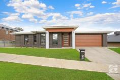  4 Ziebell Circuit Wodonga VIC 3690 $635,000 Enjoying an enviable position in the highly sought Whenby Grange Estate lies this exquisite family home, sure to impress. Recently constructed, the property features a flowing floorplan providing space with a focus on light and bright open plan living. Comprising of three bedrooms, all including built-in storage, two of which feature walk-in robes. The master is complete with a stunning full ensuite with a large shower and separate bath, ensuring the parents can enjoy a quiet space to end the day. The remaining two bedrooms are serviced by the well-appointed family bathroom. Upon entering the property, you are greeted by the oversize entry and the formal lounge, which provides an intimate setting for the family movie night. High ceilings allow natural light to fill every corner of the home, which is evident as you enter the open plan living and dining room. The central hub of the home is the living and dining room, this space is highlighted by exquisite finishes, with the gas log fire and huge matte black ceiling fan being statement pieces. The kitchen, sitting adjacent features an abundance of bench space and storage options with a deep walk-in pantry and modern appliances, sure to impress even the fussiest of cooks. Designed with a focus on indoor and outdoor living, the spacious alfresco wraps around the main living zone, providing multiple entertaining options, with additional alfresco access provided off the 2nd bedroom. Situated on an approx. 722m2 block and enjoying an elevated position, with beautiful views of the surrounding hills, there is plenty of room for the kids or family to enjoy the expansive yard. Other notable features include ducted heating, evaporative cooling and a double lock-up garage that provides vehicle security. Positioned in one of Wodonga's premier estates, this rare offering allows the astute purchaser to skip the building process and enjoy a family home with distinct class and design. Call today! 