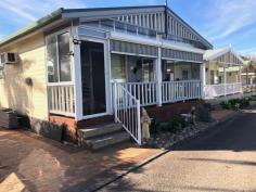  52/396 Princes Highway Ulladulla NSW 2539 $310,000 Beachside Village, is a quiet and tranquil park that backs on to the beautiful Racecourse Beach in Ulladulla. You are literally minutes from dipping your toes in the sand and enjoying a swim in the ocean. This village park is only a 2-3 minute drive into Ulladulla CBD where you can enjoy many restaurants, shopping and entertainment. The park is very friendly and definitely has a village community feel to it and is surrounded by an open nature reserve. IMPORTANT: occupation is only 182 days per year. You can rent it or holiday let it out but you will be using your 182 days. Park fee $155 per week. The unit offers – – Good sized lounge – Meals area with a view of the ocean – Raked ceilings – Kitchen with plenty of bench space, cupboards and a half sized dishwasher – Two good sized bedrooms with built in robes – Bathroom with shower over a corner spa bath and has a skylight ceiling to enjoy the night sky – Separate toilet – Laundry incorporated in the bathroom – Front covered entertaining deck with views of the ocean – Blinds on the deck for privacy and protection if it is windy – Heating and Cooling – Single car space along side the unit but long enough for two vehicles or a car and a small boat – Bottle gas – Gas cooking – Land is approx.. 10 x 13m2 – Auto watering system – New blinds – Furniture is WIWO – Only a two minute easy flat walk to the beach The park offers – – The units in the park are only to be used for up to 182 days – You could potentially rent it out for holiday letting for up to that 182 days but you would be using those days – You can have up to 2 small dogs – Enclosed and outdoor camp kitchen – Outdoor BBQ.. 