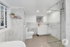  10 Long St Paddington QLD 4064 This wonderful property shows that great things come in all shapes and sizes. Beautifully presented and in a fantastic location, just a short stroll to Paddington Central, this renovated workers cottage is an absolute delight. It has a lovely feel, with an open front porch welcoming you to the home. It has polished timber floors throughout and an open plan lounge and dining room with a/c. The kitchen has been recently renovated and is bright and fresh, with gleaming cabinetry, stone benchtops and a sizeable corner pantry. There are two good-sized bedrooms, both with storage and ceiling fans. The renovated bathroom is spacious and luxurious, with marble tiles, quality fixtures and an indulgent bathtub. The large laundry also has great storage room. A rear, paved terrace is a practical and useful extension of the home, while further back, steps meander through the garden to a lofty gazebo. This is an inviting, tranquil spot to relax or entertain friends, while enjoying an outlook across the local area. There’s a carport, however you are so close to everything you’ll rarely need to drive. Paddington Central, numerous cafes and restaurants are within easy reach as is a bus stop with regular services to the city. This pretty as a picture home offers superb, inner city buying – great for down-sizers, first home buyers and investors. 