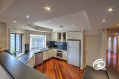  35 Coachwood Crescent Narre Warren VIC 3805 $930,000 - $980,000 Impeccably finished to the highest standards this stunning four bedroom plus study residence provides the perfect lifestyle for a growing family. Nestled on an elevated block in a blue-chip location with easy access to all services including Westfield shopping centre, freeway, schools and sporting facilities. Features split level design with separate living zones, the central kitchen has a huge walk-in pantry that has direct access to garage. There are two separate oversized garages allowing storage for three cars plus ample workspace. Some of the numerous extras include a superb built-in bar, jarrah polished floorboards, fully air-conditioned and quality fittings. Entertain in style all year round under a covered pergola complete with pizza oven before spending a relaxing day by the sparkling inground pool that is complimented by a heated spa. So much more to see and appreciate by inspecting this quality home. 