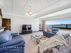  15 Red Knights Road Sandy Bay TAS 7005 $1,495,000 Perfectly positioned to capture mesmerising panoramic views across the sparkling waters of the River Derwent and an abundance of sunshine, this remarkable home sits within one of Sandy Bay’s most sought-after streets, offering a rare opportunity to secure a prestigious property in a tightly held enclave. Pleasantly elevated, natural light and warmth floods the home. A formal living room features large windows framing the picturesque outlook, which flows into the sophisticated dining room with equally as impressive water views. Sky-high ceilings throughout are adorned with ornate cornices and mouldings, allowing original 1930s attributes to seamlessly blend with contemporary living and understated elegance. Black granite benchtops glisten beneath skylights within the spacious kitchen, with a central island bench and casual sitting or dining room adjacent. Quality timber cabinetry provides significant storage space, and quality appliances are all on-hand, including a Chef oven, AEG gas stovetop, Robinhood rangehood, and Westinghouse refrigerator. Comfortable accommodation comprises of three generous, bright bedrooms, branching from the expansive hallway. Each bedroom contains built-in wardrobes, with additional closet space and an en-suite adjacent to the master. The north-facing bedroom at the front of the home boasts sensational views and plenty of sunshine. The family bathroom is ultra-spacious and features a bath, corner shower, large vanity with under-bench storage space, and a toilet. The European laundry is tucked neatly within bi-fold doors, with outdoor access nearby, and plenty of space for necessary appliances and storage. Gas ducted heating throughout ensures optimal comfort, coupled with natural warmth and sunlight. A wonderful residence to host family and friends, inside extends outdoors with entertaining spaces enhanced by an expansive courtyard, partially sheltered for year-round enjoyment. The grounds are fully fenced and offer a great deal of privacy thanks to manicured hedges encasing the tiered gardens and surrounds. At the front of the home, prominent hedging ensures seclusion while the home’s elevated position still allows for unobstructed water views. Garden paths weave around established gardens, with a delightful birdbath attracting local feathered visitors. The lengthy driveway provides ample off-street parking, with a carport secured by remote controlled roller door. Additional storage space is also located in a secure shed within the grounds. With a stately street presence and alluring views that are the envy of all who visit, 15 Red Knights Road offers a lifestyle filled with convenience, comfort, and comfortable living in one of Hobart’s most desirable waterside suburbs. 