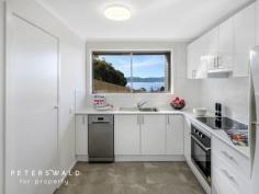  1/1 Buchanan Avenue Sandy Bay TAS 7005 $645,000 Nestled at the end of a private driveway in a quiet, quality cul-de-sac locale this solid brick, two bedroom unit offers low maintenance living in a highly desired location capturing beautiful river views. One of only two residences, this thoughtfully renovated ground floor unit offers an open plan modern kitchen and dining with separate sun drenched living room. Both spacious bedrooms feature BIR whilst the bathroom has been upgraded and comprises a separate bath and shower. Surrounded by low maintenance gardens with off street parking for 3 cars, this property is ideal for those looking to downsize, enter the market or invest whilst enjoying a low maintenance home within walking distance to Nutgrove Beach and parklands along with being just a short commute to UTAS, Sandy Bay shopping precinct, quality schools and the CBD. 