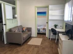  70/396 Princes Hwy Ulladulla NSW 2539 $195,000 Beachside Village, is a quiet and tranquil park that backs on to the beautiful Racecourse Beach in Ulladulla. You are literally minutes from dipping your toes in the sand and enjoying a swim in the ocean. Have your morning coffee on the sea view deck and watch the whales go by. This village park is only a 2-3 minute drive into Ulladulla CBD where you can enjoy many restaurants, shopping and entertainment. The park is very friendly and definitely has a village community feel to it and is surrounded by an open nature reserve. IMPORTANT: occupation is only 182 days per year. You can rent it or holiday let it out but you will be using your 182 days. Park fee $134 per week. Gas/electricity to be paid by owner. The unit offers – – Good sized lounge with ocean views – Renovated kitchen with timber bench and plenty of workspace and cupboards – gas cooktop – Meals table in the kitchen – Two good sized bedrooms – Bathroom with shower, vanity and W/C – Heating and Cooling – Huge concrete car space – Bottle gas – Land is approx.. 10x 9.5m2 – Furniture is WIWO – this property has a cute retro feel about it – Only a two minute easy flat walk to the beach The park offers – – The units in the park are only to be used for up to 182 days – You could potentially rent it out for holiday letting for up to that 182 days but you would be using those days – You can have up to 2 small dogs – Enclosed and outdoor camp kitchen – Outdoor BBQ.. 