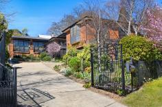  24 Holly St Bowral NSW 2576 $1,850,000 Offering a superb lifestyle opportunity set amid an elevated garden paradise, this lovely home presents so much more than meets the eye. Delivering superb liveability and impressive proportions, boasts extraordinary potential for transformation. Placed in a prized Old Bowral street with a myriad of conveniences on your doorstep, the benefit of its elevated position is only truly understood once you are able to immerse yourself in its breathtaking views. Features include: Elevated block of 891 sqm Ideal indoor/outdoor integration Selection of sunny outdoor spaces Huge living room with leafy views Formal dining opens to alfresco terrace Open plan family lounge, dining, kitchen Kitchen with gas cooktop, wall oven, corner pantry, tiled splashback Dining room with electric heater North facing terrace with town views Abundance of floor to ceiling windows Three bedrooms with built ins Bedrooms 1 and 3 with outdoor access Two fully tiled bathrooms, one with a bathtub Separate studio / potential home office Rear courtyard Single garage with workshop and sub floor storage Ceiling fans and gas hydronic heating Tiled floors Exciting potential.. 