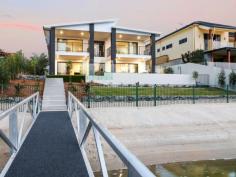  7 Beverley Crescent Broadbeach Waters QLD 4218 Positioned in arguably Broadbeach Waters finest streets amidst the famous Golden Triangle and offering an enviable wide water aspect. This home presents its new occupants the ideal and luxurious lifestyle the Gold Coast is famous for, with skyline views so close you can almost touch it. Boasting a thoughtful and light filled open plan design with numerous living spaces and elegant fixtures and finishes. A gourmet kitchen, complete with butlers pantry, overlooks extensive outdoor covered alfresco area, sparkling pool and fantastic water vista. Numerous living spaces throughout including separate home theatre room, upstairs retreat / library and games room allow for year round entertaining for the biggest of families. Cleverly designed with minimal differences in levels throughout create a seamless and efficient flow from the moment you enter the front gate until you step off your pontoon and onto your boat. Only moments to main river and within only a few minutes drive to Pacific fair shopping centre, Broadbeach and famous Gold Coast white sandy beaches. Features Include – Wide water views and Easterly outlook – 706m2 Allotment within the Golden Triangle – 5 Large bedrooms – Positioned in the highly-sought, rarely available ‘Golden Triangle’ – 4 Modern bathrooms with quality fittings – Separate family retreat with balcony – Upstairs master retreat with captivating city skyline views of Broadbeach & Surfers Paradise – Expansive contemporary style kitchen with butlers pantry – Undercover outdoor entertaining area – Ducted air-conditioning – Sparkling waterside inground swimming pool – Secure double garage + off street parking – Prime position close to Pacific Fair, Star Casino, Convention Centre, Broadbeach & Surfers Paradise.. 