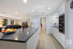  50 Huon Creek Road Wodonga VIC 3690 $960,000 This beautifully renovated home is sure to excite all who enter, but the best part is the separate unit for a "Special Nanna" or additional income stream. Solidly built, this 1980s, cream brick veneer home offers all that a family could require. Four generous bedrooms (with built-in robes), two bathrooms, a home office with built-in furniture, and two living areas. Then there is the stunningly renovated 2pak kitchen, complete with stone benchtops, a proper butler's pantry, induction cooktop, pyrolytic oven, and dishwasher. Ducted heating and cooling throughout the home make for year-round comfort for your family and being a block of 2170m2 will give everyone room to play, grow vegetables or just relax. Your outgoings will also be reduced with a 10kw solar system. This tremendous-sized block is enhanced by the fact that you have rear yard access for a caravan, trailer, or additional cars as well as two carports at the front with the curved driveway and more parking spaces. There is no shortage of storage in this well-balanced home with additional cupboards in the kitchen, laundry, and hallways. Added to this is a workshop with 15amp power and a garden shed. The pool is low maintenance, saltwater, and self-chlorinating. Paved, covered and right beside the pool, is a beautiful, private outdoor kitchen, featuring a BBQ, glass door wine fridges, lots of bench space, and hot & cold running water. Plenty of room here for an outdoor lounge and dining area so you can relax whilst you watch the kids playing in the pool. Included in the covered area is the breezeway leading to the modern Granny Flat. And what a lovely home this would make for Nanna or a maturing child who needs a little independence. An open-plan lounge/dining/kitchen and a separate bedroom with ensuite and built-in robes come together to provide a safe haven, with the added benefit of the use of the beautiful outdoor area. 
