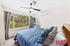  40 Bourbon St Wyoming NSW 2250 A well presented family home in a quiet street of Wyoming with transport and shopping centres close by this home would an array of buyers including the young family, first home buyer, investor or downsizer. - Three bedrooms, main with reverse cycle air conditioning, one with built in robe & all with ceiling fans - Good size main living area which leads into a rumpus room or 2nd living area with air conditioning - Renovated bathroom with wall hung vanity, floor to ceiling tiles, frameless shower screen & bathtub - Well presented galley style kitchen with ample storage - Timber floors throughout the living areas and carpet to the bedrooms - Full length entertaining deck at rear overlooking the large yard and reserve at rear - Internal laundry - Access through a gate to the reserve which leads you onto Alan Davidson Oval so plenty of space for the kids - Single carport and covered deck area to the entry of the home 