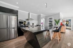 10 Shepherds Glen Strathfieldsaye VIC 3551 $900,000 - $990,000 In the heart of Strathfieldsaye we have a stunning 4 bedroom, 2 bathroom property on nearly 2 acres that sets itself apart from the norm. Built with careful attention to detail, this Bondor clad home is thermally efficient, fire and termite-proof and complimented with double glazing throughout. Designed as a 'smart home, you can communicate with your Assistant of choice, (Alexa, Google Home etc). The home has ducted heating and cooling, ceiling fans in every room and an abundance of USB port powerpoints. The designer kitchen is truly the heart of the home, boasting beautiful sparkling 40mm benchtops, a 6 seater breakfast bar and a 900mm Westinghouse pyrolytic oven (never needs cleaning) which can be turned on and off remotely. There is a huge walk-in pantry with 3 double powerpoints and space for all appliances which keeps your benchtops free. The stunning open plan kitchen looks out across the living and dining area. Which drinks in views of the expansive garden. Whilst much of the hard work has already been done, there is plenty of scope (and space) to further enhance the outdoor area. The master suite is enormous and boasts a reading or sitting area which opens up to its own private patio. There are dual walk-in robes while the ensuite bathroom has a twin vanity, oversized shower and separate toilet. All remaining bedrooms are oversized and offer large built-in robes. Even the robes are high spec, with double hanging, single hanging and built-in shelves. The theme of storage being the order of the day continues through the home, with the full-size laundry offering a 4 door linen cupboard from wall to wall, and a separate, second linen closet servicing the 3 minor bedrooms. This fabulous home also boasts 3 living spaces and has a separate study nook. Externally we have from front to back, established gardens, a double lock-up garage and separate side access for the trailer, boat or van. To the rear, we have a large undercover alfresco entertaining space and a large sealed area to sit out and enjoy. Further back, the block becomes a huge slice of low maintenance, country tranquillity, boasting beautiful native fauna and two small dams. Imagine having this wonderful space, literally at your back door. There are two separate areas for leisure with trampoline, swing set and fire pits and a caravan under carport for the kids to play in. 