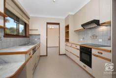  197 North Road Chiltern VIC 3683 $649,000 "Nulgerong" is a rare rural/residential property on 5 Acres, only 1km from centre of Chiltern township. This generous family home would be perfect for those also wanting space for their beloved horses or even to graze a few cattle. This brick veneer residence, built approx. 1972, offers four bedrooms – two with built in robes and the spacious master has a walk-through robe and a private ensuite. The huge central kitchen flows into both a lounge room, with a separate dining area and the family room, which has space for a study nook. The family room leads to three bedrooms and the main bathroom, making it the perfect kids' rumpus room. As well as a double lockup garage with remote control roller doors and a garden shed, this property also has a neat, 5 x 5m, open front storage shed with a concrete floor, ideal for a boat, extra cars, or a workshop. This property is on a bend in the road so it offers many potential uses for the land. It also abuts an unused roadway so there is additional land beside the block that you may be able to utilize (STCA). The grounds around the house boast mature, low maintenance, native trees and shrubs along with some productive fruit trees. A mix of standard and raised garden beds make up the fruitful vegetable garden. With approx. 5acres you can have the kids' horses, a couple of goats and room for a motorbike if that's what you're into. "Nulgerong" is serviced by mains water, a rainwater catchment tank plus two dams! The property fronts a main sealed road and is within walking distance to Chiltern's town centre, primary schools and sporting facilities. 