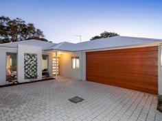  29 Wonga Rd Morley WA 6062 Near new, and inspired by minimalist sophistication, crisp white walls, floor to ceiling windows and a muted colour palate work cohesively with the warm timber flooring to create sense of airiness. Privately nestled on a low maintenance 326sqm rear block, this stunning 3 bedroom, 2 bathroom Scandinavian styled abode feels like a tranquil sanctuary from the moment you arrive! The heart of the home is the spacious open plan kitchen, dining and living area, the ideal social hub for family living and entertaining. Floor to ceiling windows fill this space with gorgeous natural light, whilst the herringbone feature wall and high recessed ceilings add a touch of class. Destined to be the spot where everybody gravitates to, the crisp all white kitchen is a culinary delight. Complete with 900mm stainless steel oven and gas cooktop, stone benchtops, double sink, dishwasher, ample cabinetry, breakfast bar and feature pendant lighting, the open concept design ensures no one misses out on the conversation. Flowing out to the solid timber decked alfresco and rear garden, built in bench seating, matte black ceiling fan and synthetic turf make this space ultra-practical, whilst the trellised planting will soon create a lush green oasis for years to come. Furthermore, with direct roller door access to the double garage virtually doubling the space on offer, entertaining all your family and friends never became easier! Ideal for family movie nights or taking in the big game, the separate media room is sure to be a crowd favourite. Complete with wall hung media centre, the only thing missing is the choc tops, popcorn and your favourite comfy sofa! Well proportioned, and bathed in natural light, the master suite is an ideal sanctuary to kick back and relax after a hard day’s work. Playing host to both built-in and walk-in robe plus ensuite, the latter boasts a double sink vanity, extra wide shower and ample built in storage. Equally generous in size, and featuring mirrored built in robes, the remaining two bedrooms are serviced by the crisp and modern family bathroom boasting separate shower and bathtub plus separate W/C. Additionally, ducted reverse cycle air-conditioning throughout ensures year round comfort, keeping you warm in winter and cool in summer. Positioned on the Noranda border walking distance to Hawaiian’s Noranda, with the Galleria a few minutes’ drive, numerous schooling and public transport options close by, plus the CBD less than 10kms away, the practicality of living here will be hard to beat! 